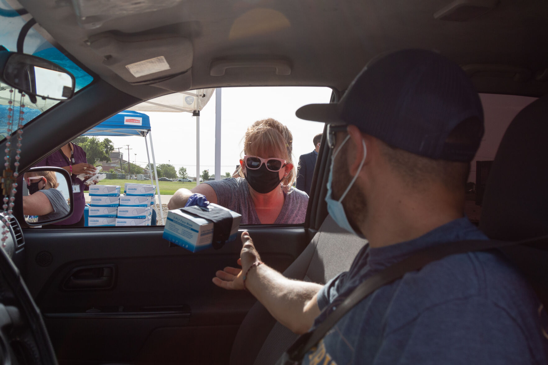Photos: Cars line up for over three miles at Arlington face mask distribution